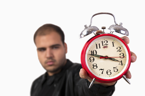 Young man with red alarm clock - Photo, Image