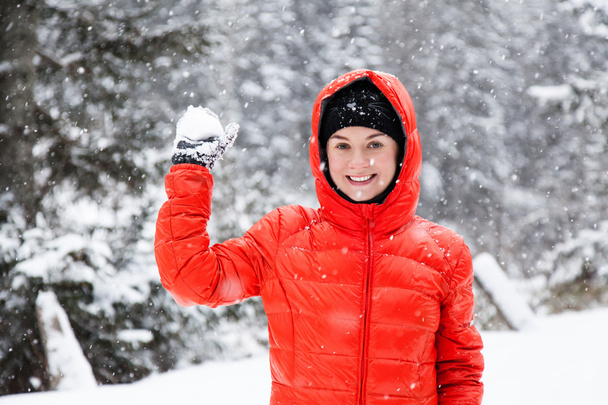 Pretty young woman playing snowballs - Photo, Image