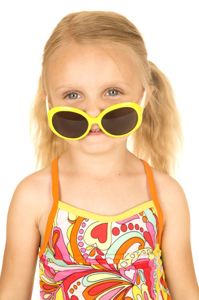 Silly blond girl wearing swimsuit and sunglasses down on nose - Zdjęcie, obraz