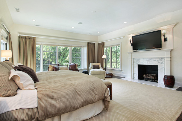 Master bedroom with marble fireplace - Photo, Image