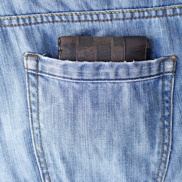 oude portefeuille in de rug pocket jeans - Foto, afbeelding