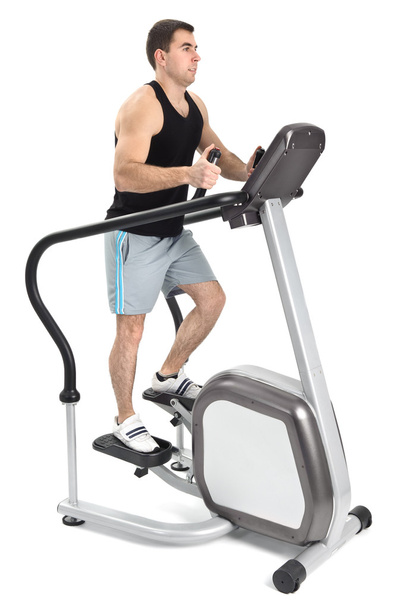 One man doing step machine exercise - Fotó, kép