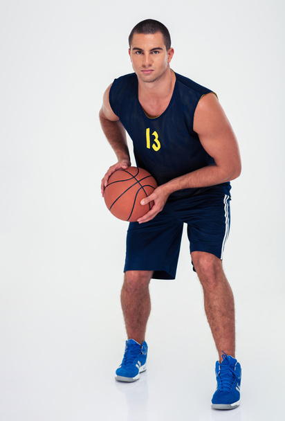 Full length portrait of a man playing in basketball - Fotó, kép