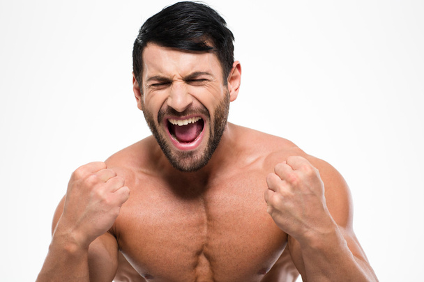 Portrait of a atheltic muscular man screaming - Zdjęcie, obraz