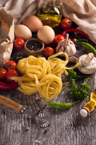 nest pasta with food ingredients - Foto, afbeelding