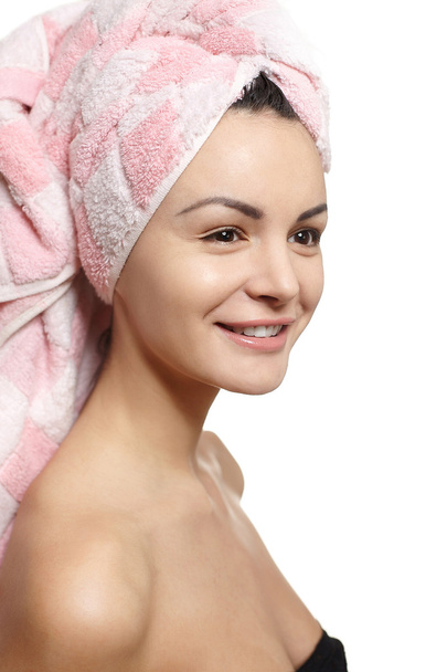 Portrait of beautiful caucasian smiling woman in towel on the head isolate - Fotó, kép