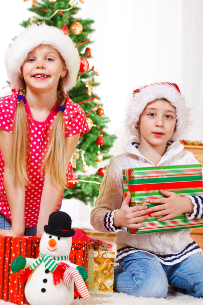 Children with Christmas presents - Фото, зображення