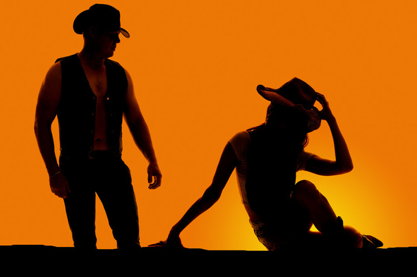 silhouette of woman and cowboy outdoor - Foto, Imagem