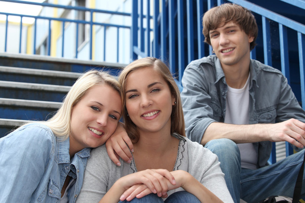 Teenagers sat on the steps - Фото, зображення