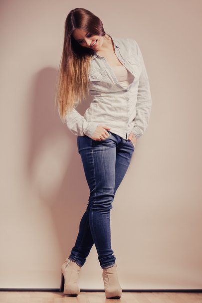 woman in  jeans pants posing - 写真・画像