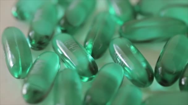 Rotating pills of Advil on white - Felvétel, videó