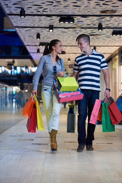 young couple with shopping bags - Photo, image