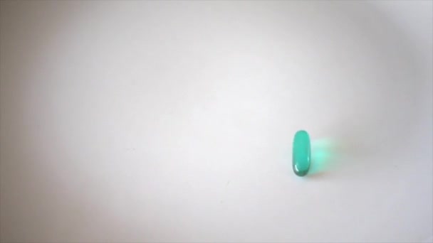 Advil pills fall in super slow motion with copy space - Felvétel, videó