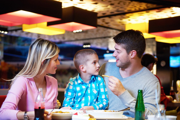 family having lunch in shopping mall - Фото, изображение