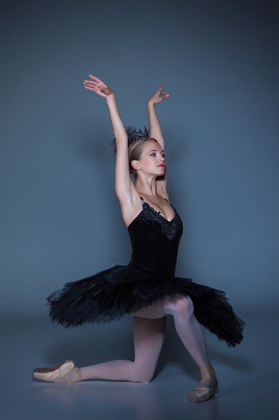 Portrait of the ballerina in ballet tatu on blue background - Zdjęcie, obraz