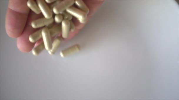 Hand throw capsules in super slow motion - Felvétel, videó