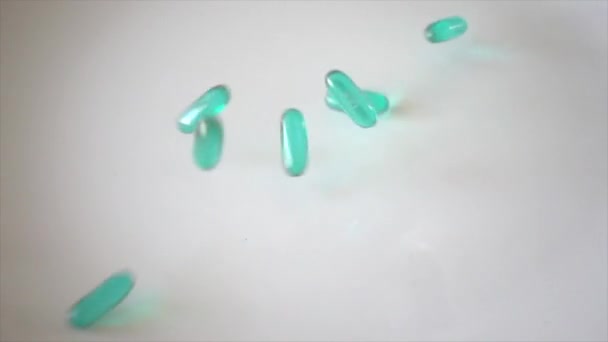 Liquid pills fall in super slow motion - Felvétel, videó