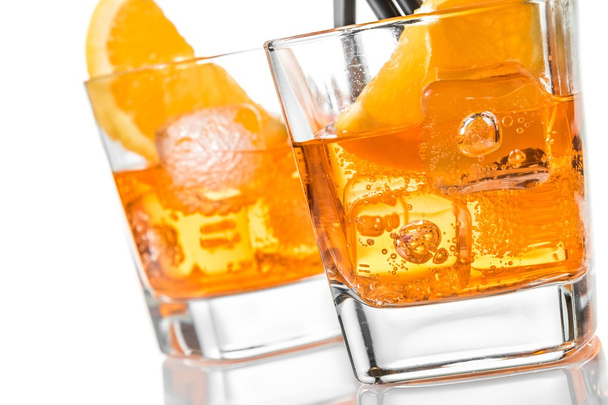 detail of two glasses of spritz aperitif aperol cocktail with orange slices and ice cubes - Fotó, kép