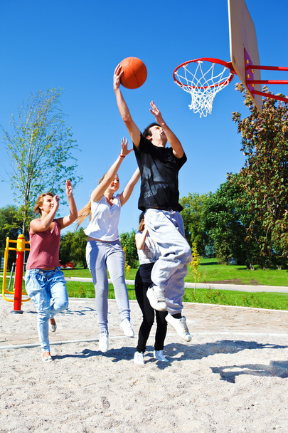Teenagers playing basketball - Photo, Image