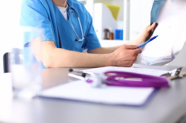 Closeup portrait of a  doctor with stethoscope holding folder - Photo, Image