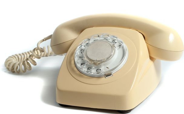 Teléfono amarillo retro aislado sobre fondo blanco
 - Foto, Imagen