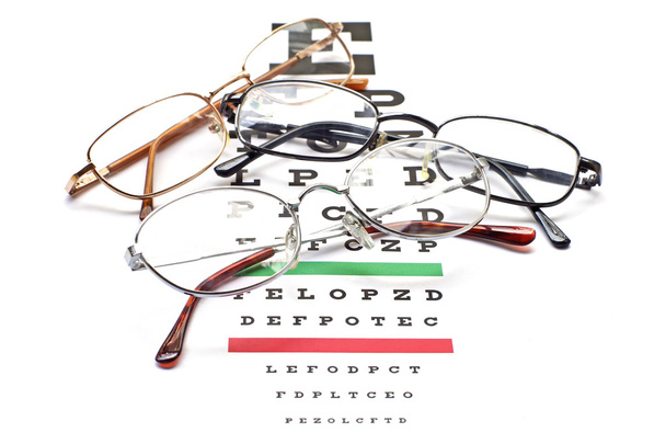 glasses on snellen eye sight chart test - Photo, Image