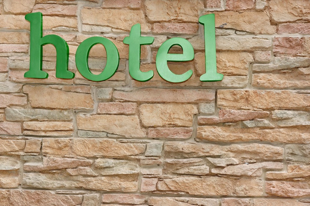 Hotel Sign On Artificial Stone Wall - Photo, Image