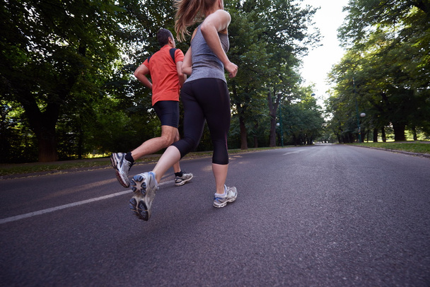 urban sports, healthy couple jogging in the city at early morning - Φωτογραφία, εικόνα