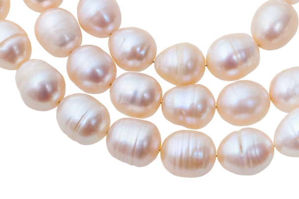 tres cadenas de cuentas de perlas rosadas del río
 - Foto, imagen