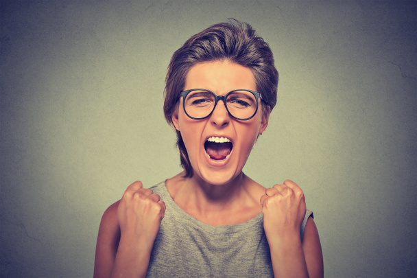 Angry young woman with glasses screaming - Photo, Image