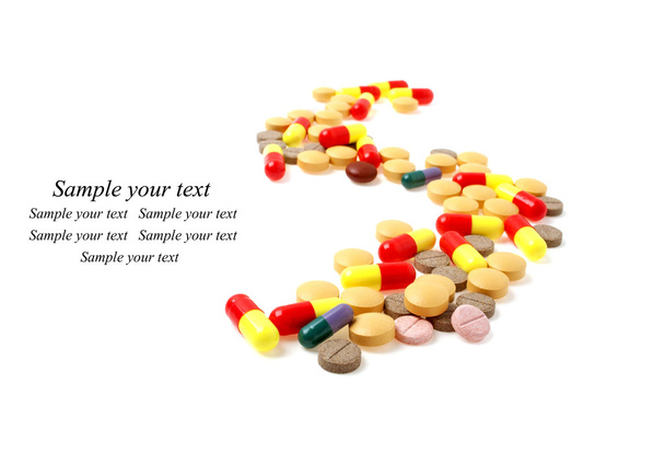 Colored pills and tablets on a white background - Foto, immagini