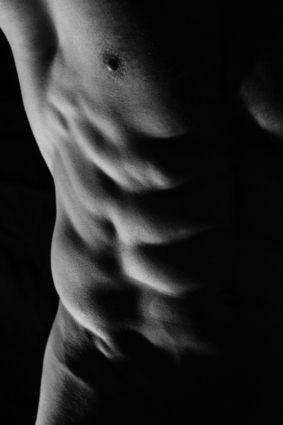 Close-up of perfect male abs, body, low key image. Man, sport, power, muscle - Fotografie, Obrázek
