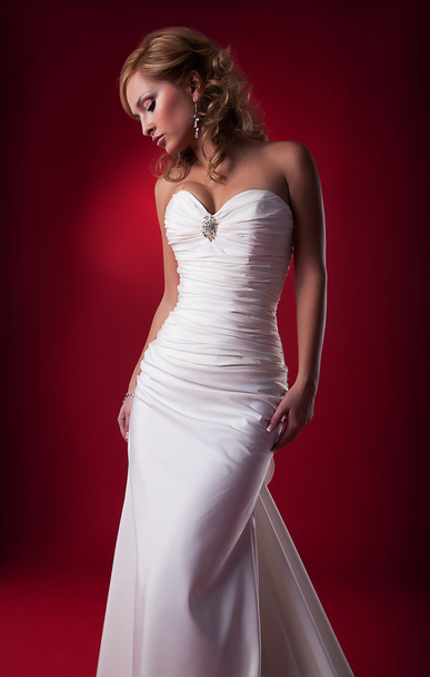 Seductive attractive blonde fiancee bride posing in studio - Фото, изображение