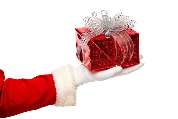 Santa claus giving  christmas present box on a white background, isolated - Photo, image