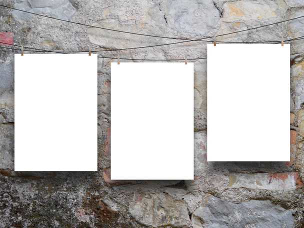 Three hanged sheets on ancient wall - Photo, Image
