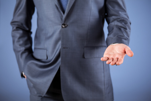 Businessman with open palm - Foto, afbeelding