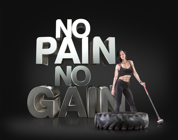 Sport woman holding a hammer on the background Motivational fitness phrases - Foto, imagen