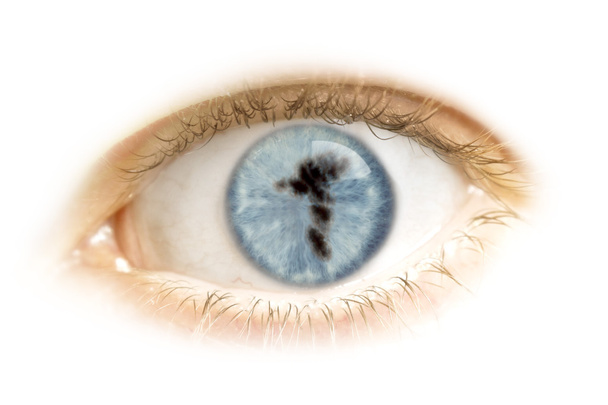 Close-up de um olho com o aluno na forma de Ilhas Faroé
. - Foto, Imagem