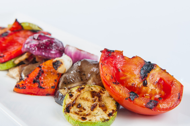 Close up Grilled vegetables on long white plate isolated - Fotografie, Obrázek