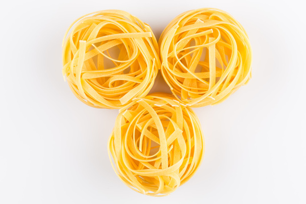Fettuccine pasta on white - Фото, изображение