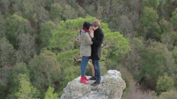 Lovely young couple kissing in the outdoors - Materiał filmowy, wideo