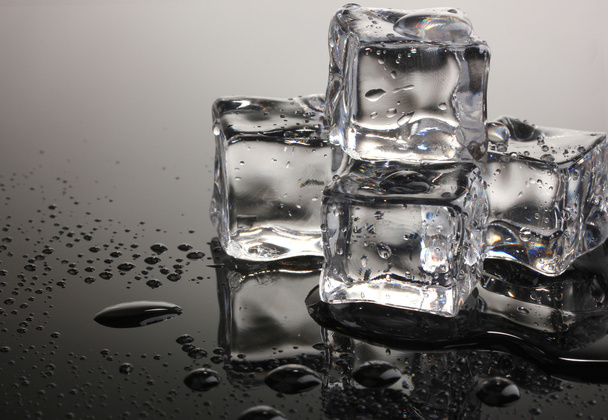 Melting ice cubes on grey background - Φωτογραφία, εικόνα