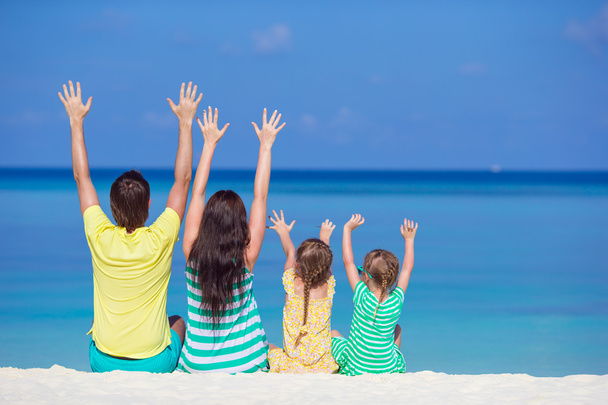 Happy beautiful family on a tropical beach vacation - Photo, Image