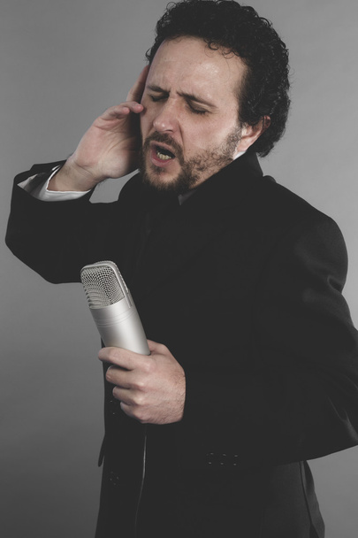 singer in suit and microphone - Fotoğraf, Görsel