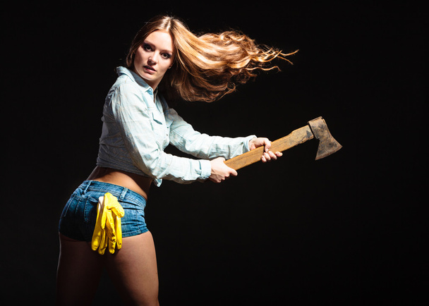 Sexy strong woman feminist with axe working. - Valokuva, kuva