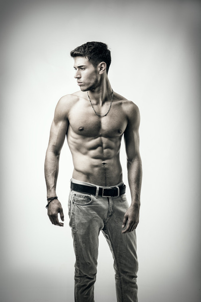 Handsome shirtless athletic young man on white - Foto, Imagem