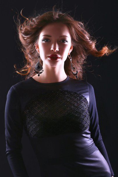 Portrait of beautiful brunette woman in black dress - Photo, Image