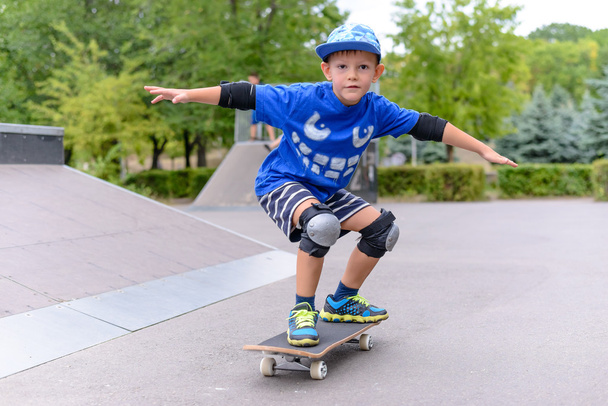 Young boy showing off on his skateboard - Photo, Image