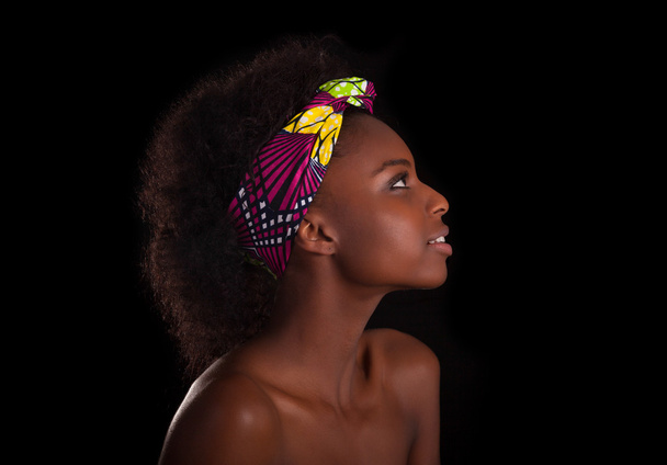 Young beautiful african woman portrait, Isolated over black back - Zdjęcie, obraz
