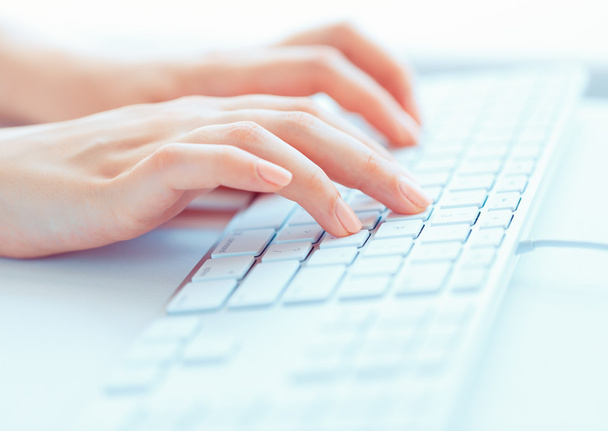 Female hands or woman office worker typing on the keyboard - Photo, Image